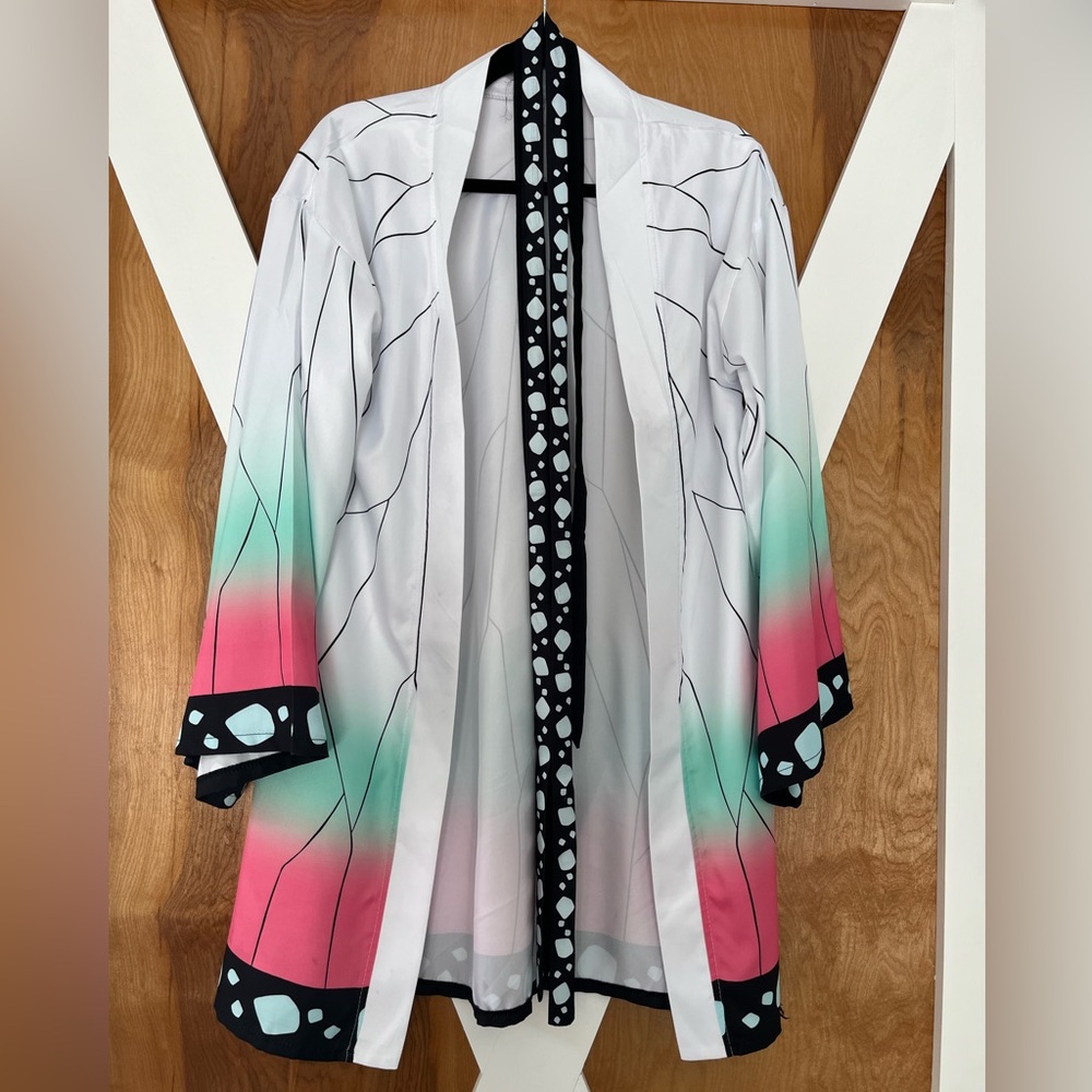Adult demon slayer costume Robe worn once. A few stains shown in pictures. small